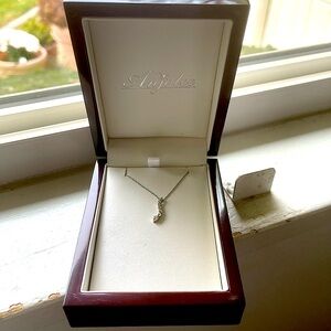 Brand new, white gold and diamonds.